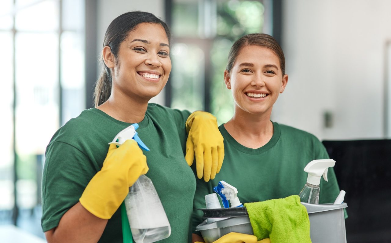 the best team to keep your office clean portrait of two young woman cleaning a modern office -Commercial -Residential -Cleaning